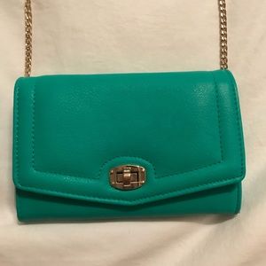 aqua crossbody purse with gold detailing